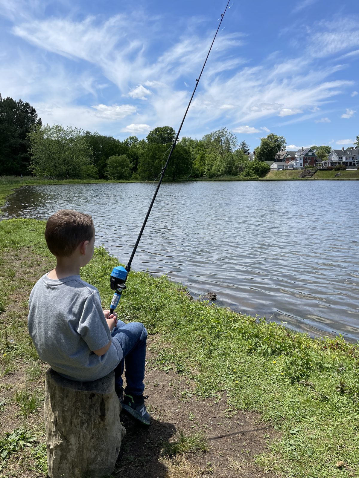 Fishing alone at the water's edge